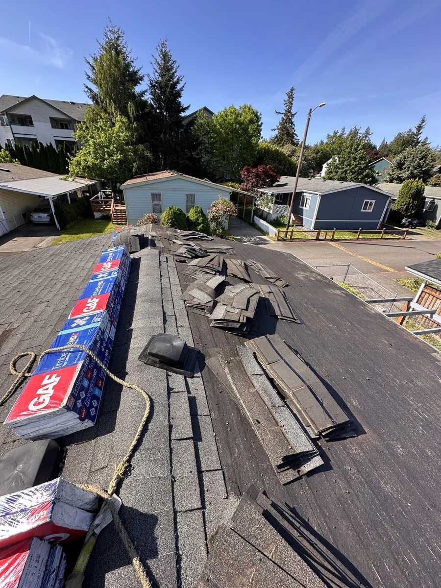 GAF Timberline HDZ shingles staged on roof before installation, SE Foster Rd, Portland OR