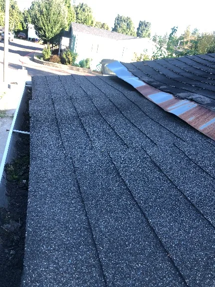Rusted valley flashing on old roof, Portland OR