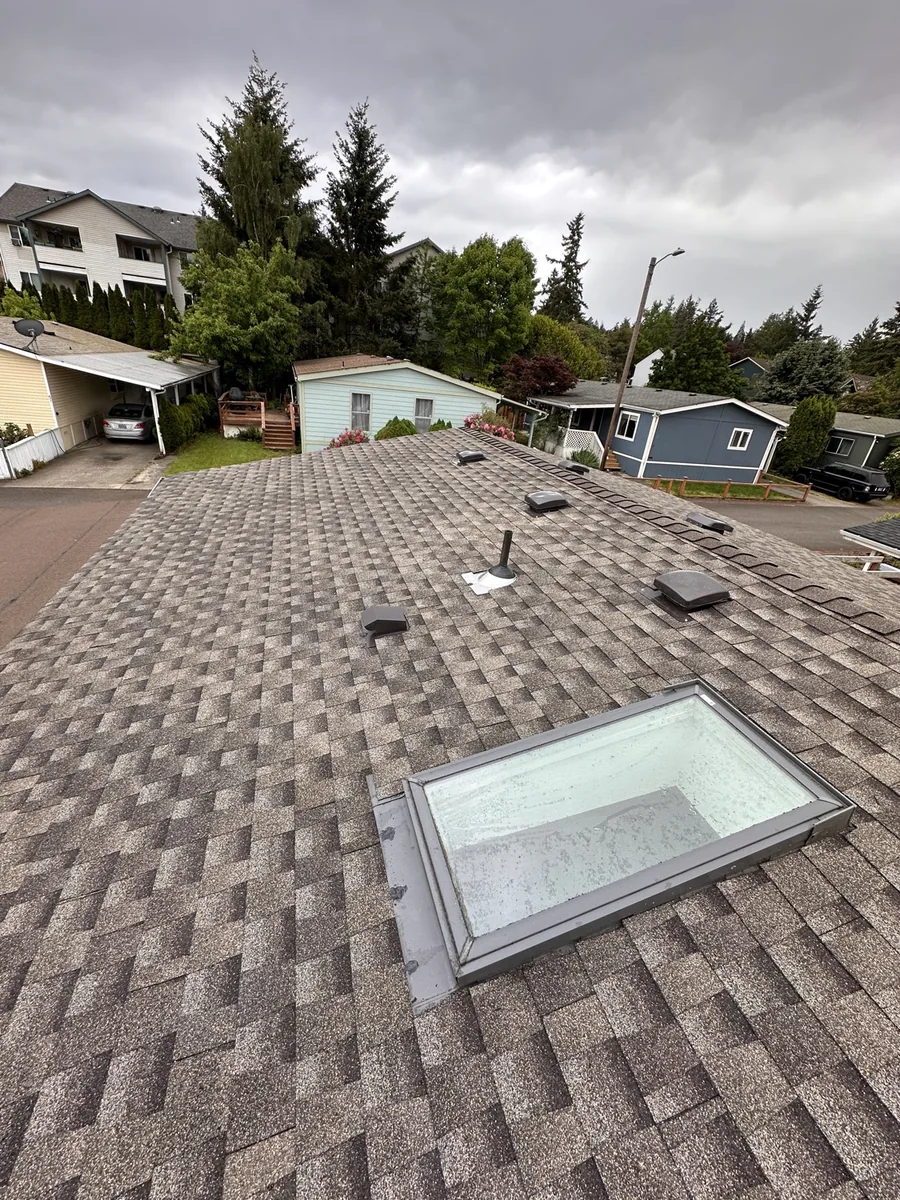 New shingle roof ridge line with roof vents, Portland OR