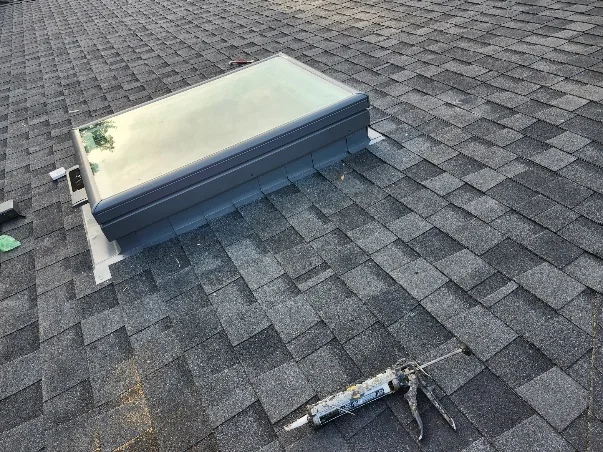 Skylight flashing sealed on shingle roof, Portland OR